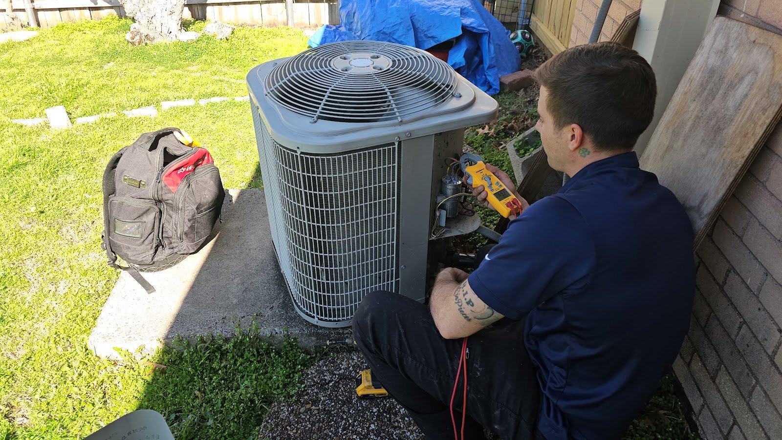 Texas Choice technician servicing an AC condenser